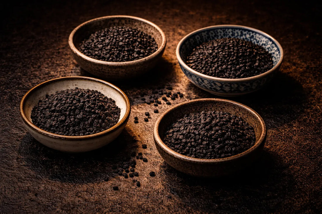 Four bowls of Nigella sativa seeds, also known as black seed, black cumin and kalonji